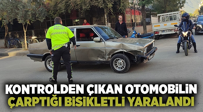 Ödemiş'te kontrolden çıkan otomobilin çarptığı bisikletli yaralandı