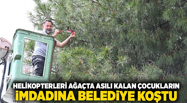 Helikopterleri ağaçta asılı kalan çocukların imdadına belediye koştu