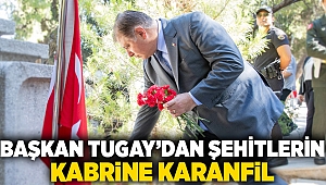 Başkan Tugay’dan şehitlerin kabrine karanfil