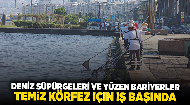 Deniz süpürgeleri ve yüzen bariyerler temiz Körfez için iş başında