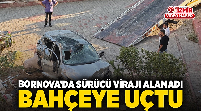 Bornova’da sürücü virajı alamadı bahçeye uçtu