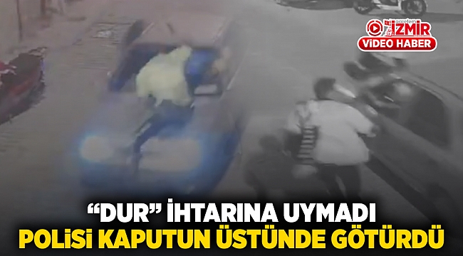 “Dur” ihtarına uymadı polisi kaputun üstünde götürdü