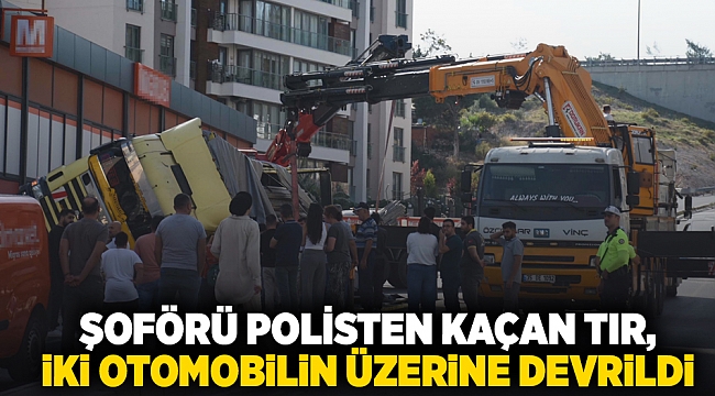 İzmir'de şoförü polisten kaçan TIR, iki otomobilin üzerine devrildi; 2 yaralı