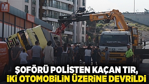 İzmir'de şoförü polisten kaçan TIR, iki otomobilin üzerine devrildi; 2 yaralı