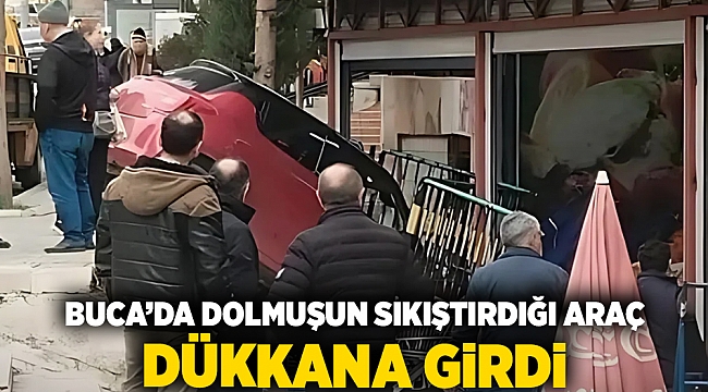 Buca'da dolmuşun sıkıştırdığı araç dükkana girdi