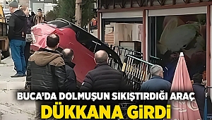 Buca'da dolmuşun sıkıştırdığı araç dükkana girdi