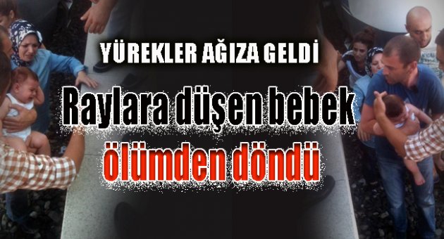 Raylara düşen bebek ölümden döndü